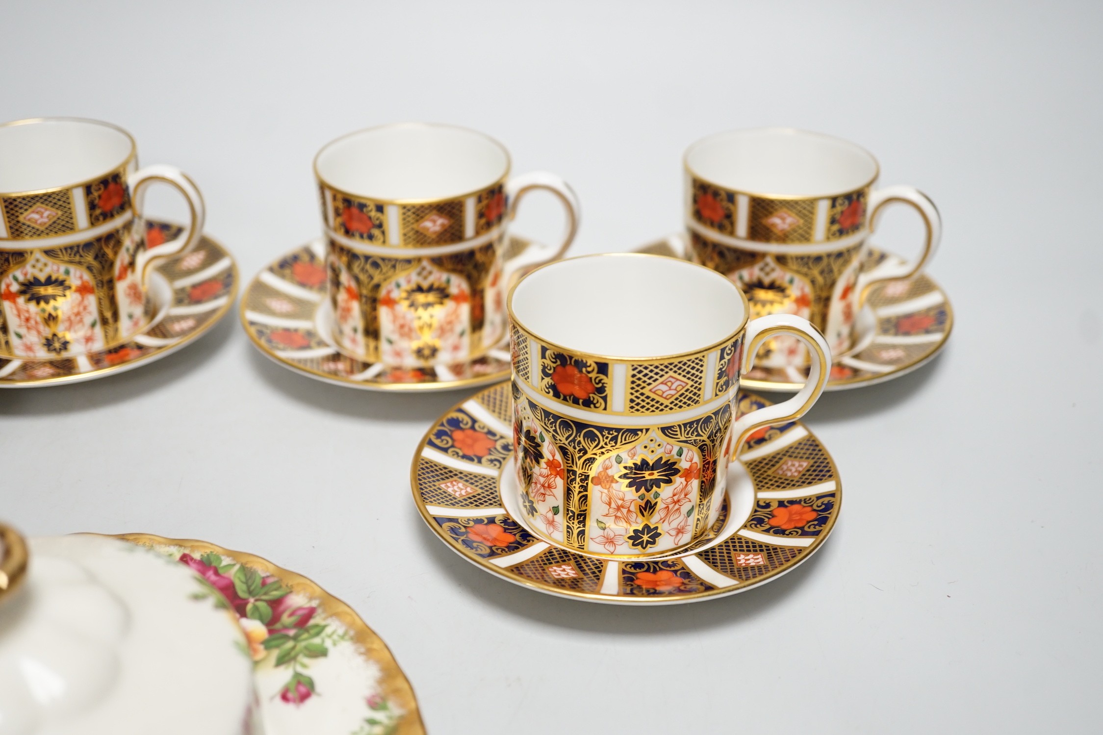 Six Royal Crown Derby coffee cans and saucers and a Royal Albert Country Roses dish and cover
